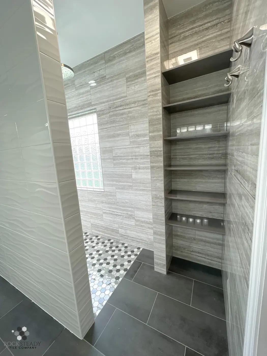 Tiled shower bench and recessed shelf closeup